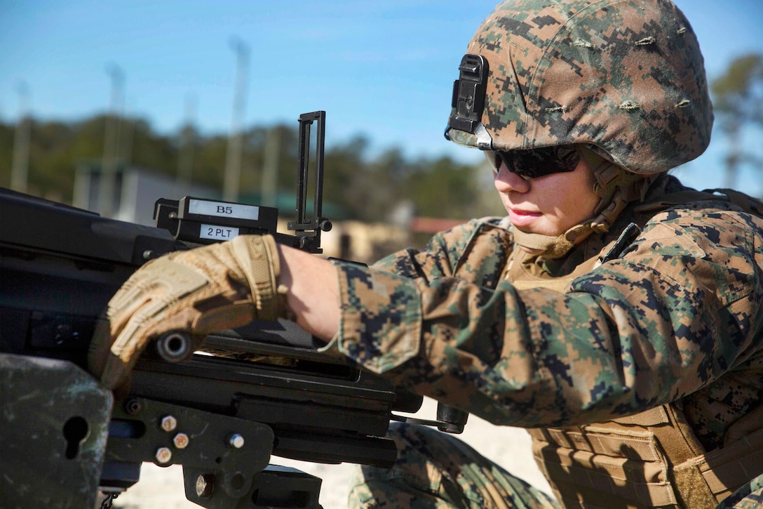 Marine Corps Lance Cpl. Melissa Bustamante prepares a 40 mm MK-19 grenade launcher during a live-fire range at Camp Lejeune, N.C.