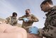 German Air Force paramedics treat a simulated burn victim during a coalition emergency response exercise February 9, 2017 at an undisclosed location in Southwest Asia. Coalition service members relied on each other’s respective skillsets to complete the training objective, just as they would have to in the event of a real-world incident. (Air Force photo by Staff Sgt. Joshua Kleinholz)