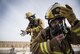 Firefighters assigned to the 332d Expeditionary Civil Engineer Squadron respond to a simulated structure fire during a coalition emergency response exercise February 9, 2017 at an undisclosed location in Southwest Asia. Smoke gathering in the building’s interior necessitates the use of respirators for first responders preparing for entry. (Air Force photo by Staff Sgt. Joshua Kleinholz)