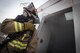 A firefighter assigned to the 332d Expeditionary Civil Engineer Squadron responds to a simulated structure fire during a coalition emergency response exercise February 9, 2017 at an undisclosed location in Southwest Asia. The exercise tested the Airmen’s response time and communication in an unfamiliar location. (Air Force photo by Staff Sgt. Joshua Kleinholz)