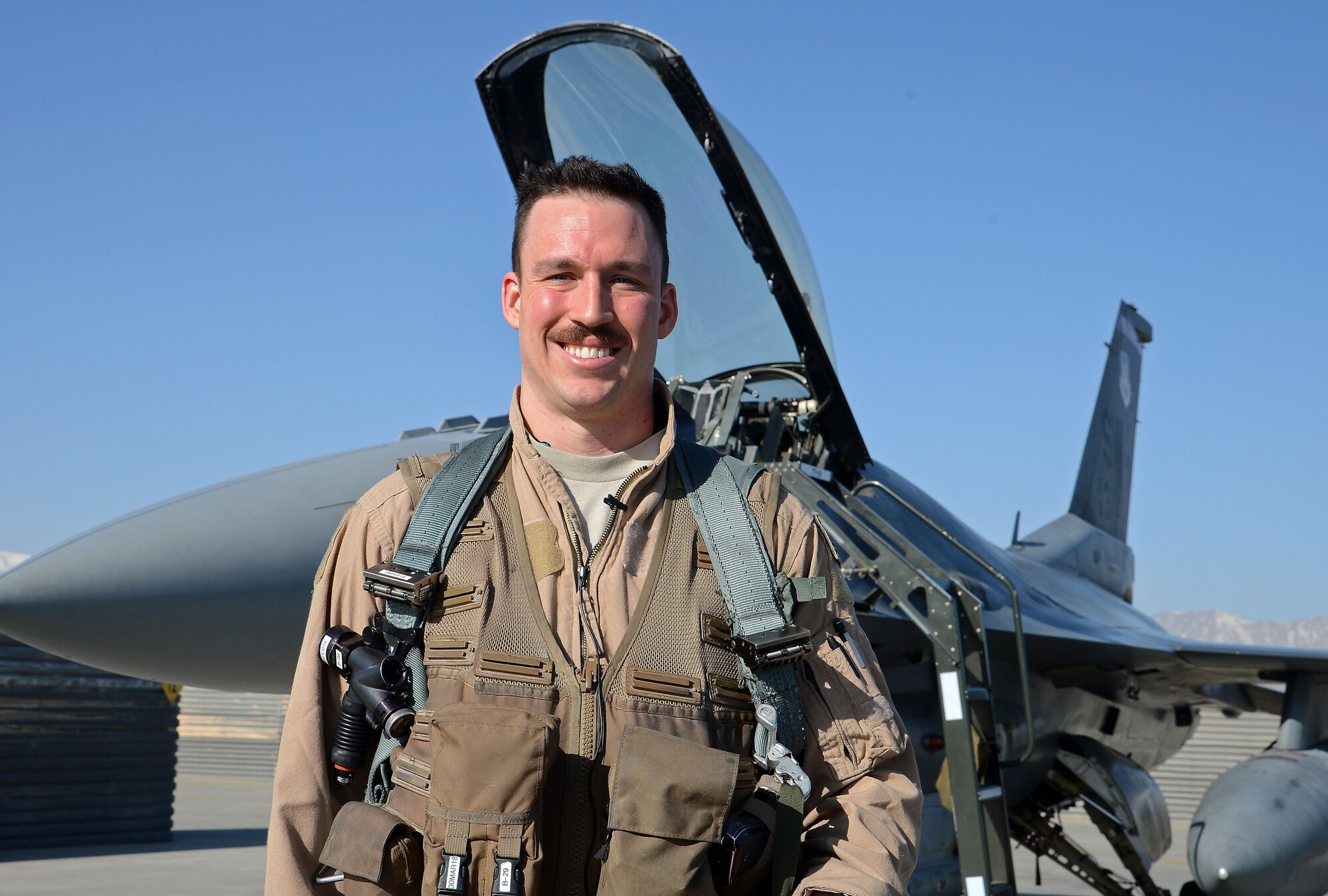 ”Slapshot”, 77th Expeditionary Fighter Squadron F-16 Fighting Falcon fighter pilot, poses for a photo Feb. 9, 2018 at Bagram Airfield, Afghanistan.