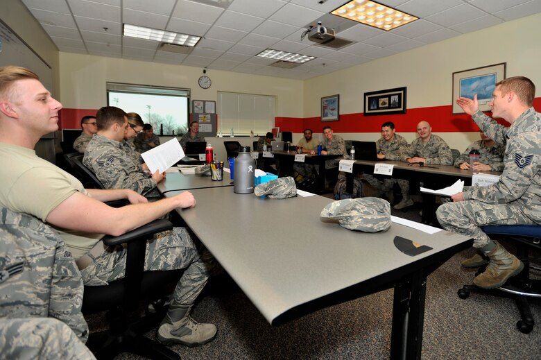 Senior Master Sgt. David B. Reid Airman Leadership School (ALS) converse with an instructor at Shaw Air Force Base, S.C., Jan. 31, 2018.