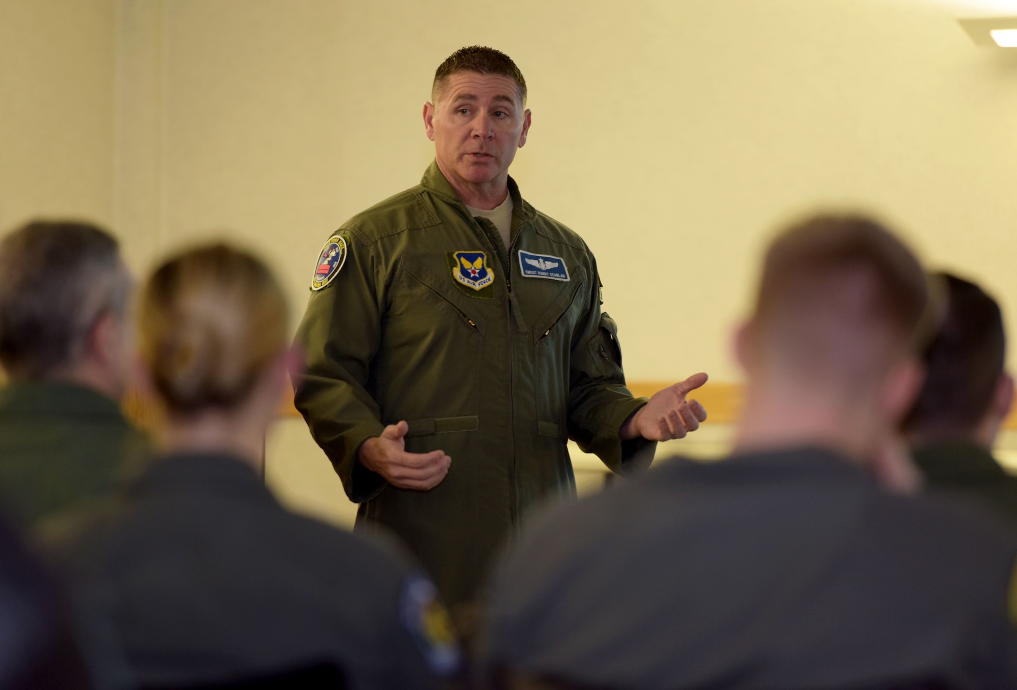 U.S. Air Force Chief Master Sgt. Randy Scanlan, Air Force Personnel Center chief of enlisted aircrew assignments, Joint Base San Antonio-Randolph, conducts a question and answer session with boom operators at RAF Mildenhall, Feb. 8, 2018. The question and answer session was one of three briefings during the senior enlisted leaders’ visit to discuss issues and programs pertaining to the CEA career fields. (U.S. Air Force photo by Senior Airman Alexandra West)