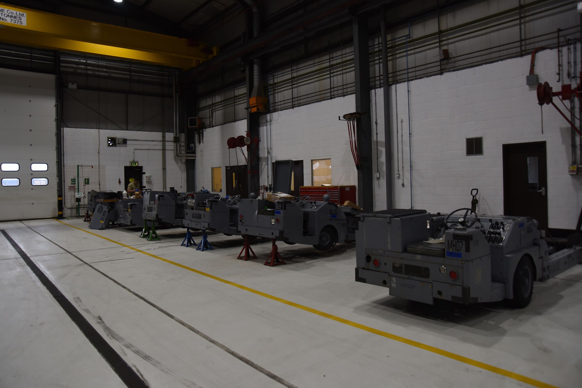 Bomb lifts sit in the 48th Equipment Maintenance Squadron aerospace ground equipment shop at Royal Air Force Lakenheath, England, Feb. 7. AGE Airmen maintain, inspect and fix any problems that arise on all 48th Fighter Wing bomb lifts. (U.S. Air Force photo/Senior Airman Abby L. Finkel)