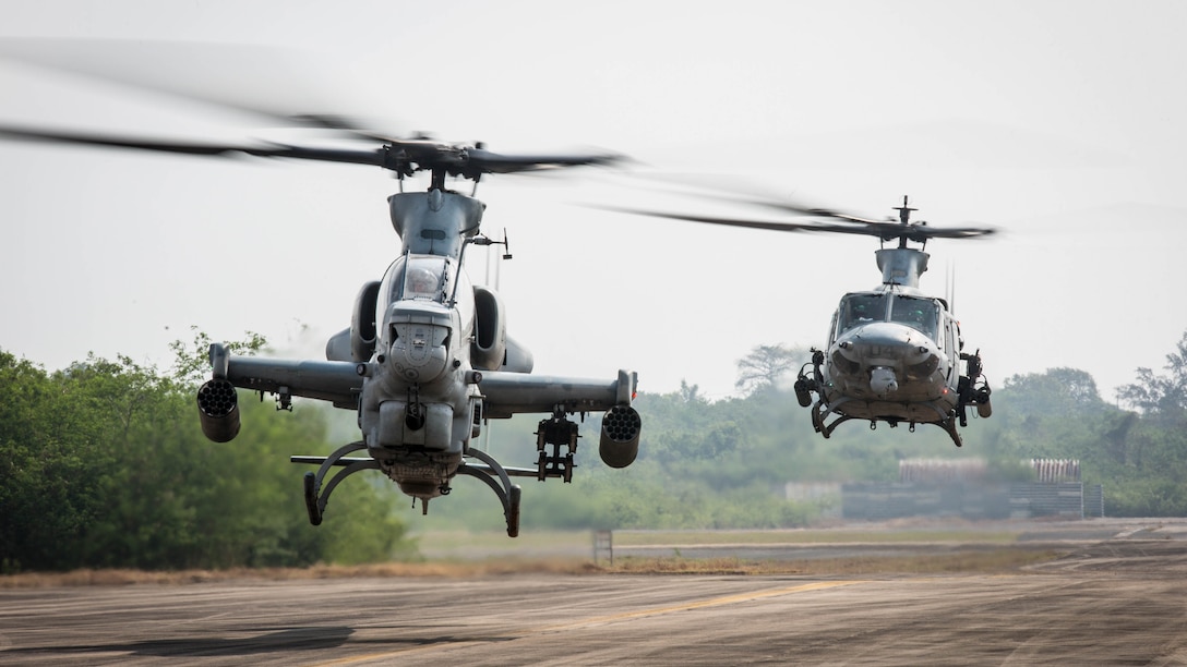 An AH-1Z Viper and a UH-1Y Venom taxis off the runway at U-Tapao International Airport, Kingdom of Thailand, Feb. 10, 2018. Marine Light Attack Helicopter Squadron 369 ‘Gunfighters’ arrive to the Kingdom of Thailand to participate in the 37th iteration of Cobra Gold as part of the U.S. Marine Corps Aviation Combat Element. HMLA-369, Marine Aircraft Group 39, 3rd Marine Aircraft Wing, is currently forward deployed under the unit deployment program with MAG-36, 1st MAW. Exercise Cobra Gold 2018 is an annual exercise conducted in the Kingdom of Thailand held from Feb. 13-23 with seven full participating nations.