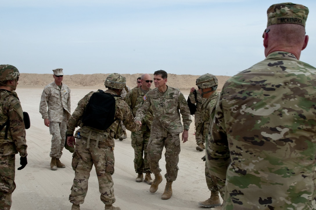 General Joseph Votel, commander, U.S. Central Command, shakes hands with Soldiers as he and the leaders of the U.S. service component commands in the Central Command area of responsibility arrive at Camp Buehring, Kuwait, Feb. 9, 2018, to witness a combined arms maneuver demonstration during Army Day. Army Day was the opening event for U.S. Central Command’s Component Commanders Conference that allowed U.S. Army Central to showcase the Army’s capabilities at the theater level. (U.S. Army photo by Sgt. David L. Nye, USARCENT PAO)