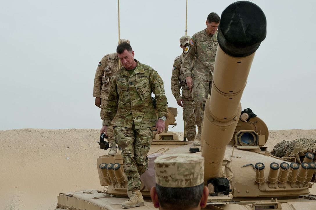 U.S. Central Command Command Sergeant Major, Command Sgt. Maj. William F. Thetford, and U.S. CENTCOM Commander, Gen. Joseph Votel, climb off of a Kuwaiti tank during Army Day at Camp Buehring, Kuwait, Feb. 9, 2018. Army Day was the opening event for U.S. Central Command’s Component Commanders Conference that allowed U.S. Army Central to showcase the Army’s capabilities at the theater level. (U.S. Army photo by Sgt. David L. Nye, USARCENT PAO)