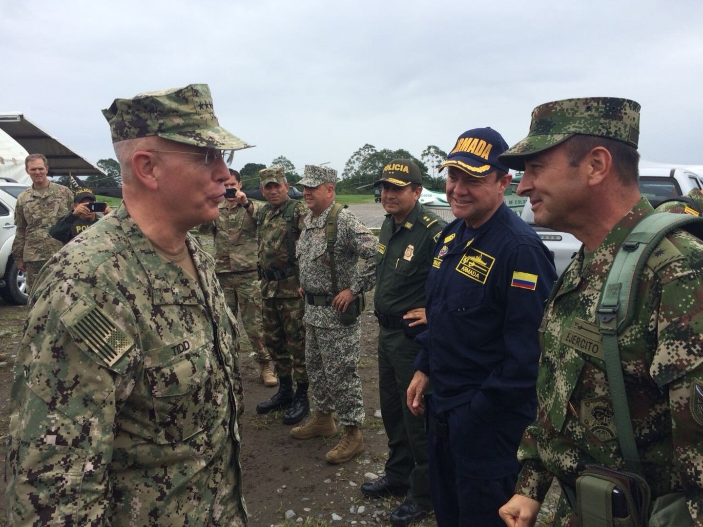 Adm. Kurt W. Tidd talks with members of the Colombian military.