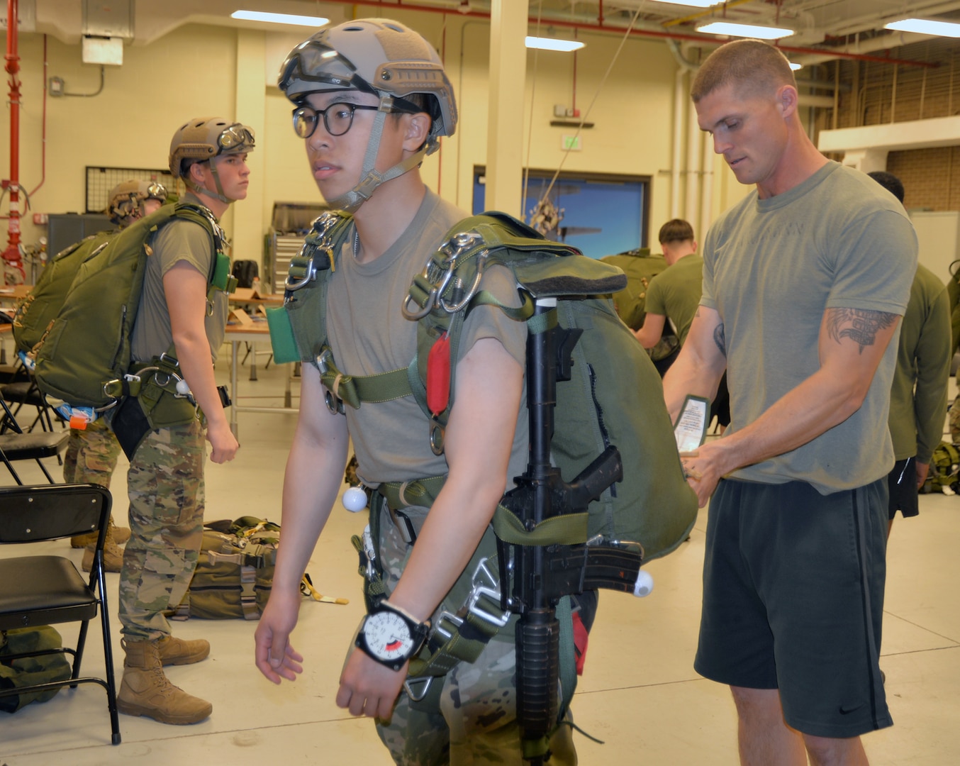 Staff Sgt. Jack Hausmann (right), 1st Reconnaissance Battalion reconnaissance Marine, conducts an inspection of military free-fall jumping equipment worn by Army Pvt. Tran Richard during a training session in the Marine Military Free-Fall Jumpmaster Course held at the 4th Reconnaissance Battalion, located at Joint Base San Antonio-Fort Sam Houston. The course started Jan. 29 and runs until Feb. 16. Students who complete the course become certified Military Free-Fall Jumpmasters, who oversee every aspect of military free-fall operations, including planning, execution and recovery.