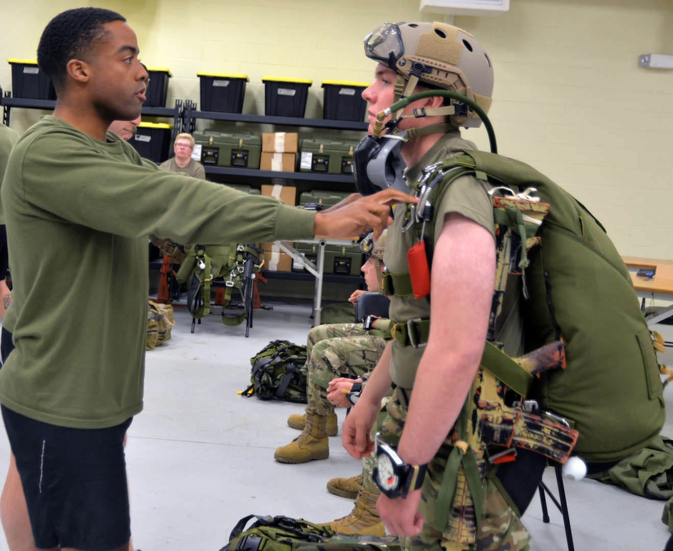 Staff Sgt. Washington of U.S. Marine Corps Forces Special Operations Command (left) conducts an inspection of military free-fall jumping equipment worn by Army Pvt. Austin Corbett, a member of Company B, 232nd Medical Battalion, at Joint Base San Antonio-Fort Sam Houston. Washington is a student in the Marine Military Free-Fall Jumpmaster Course held at the 4th Reconnaissance Battalion, located at JBSA-Fort Sam Houston. The course started Jan. 29 and runs until Feb. 16. Students who complete the course become certified Military Free-Fall Jumpmasters, who oversee every aspect of military free-fall operations, including planning, execution and recovery.