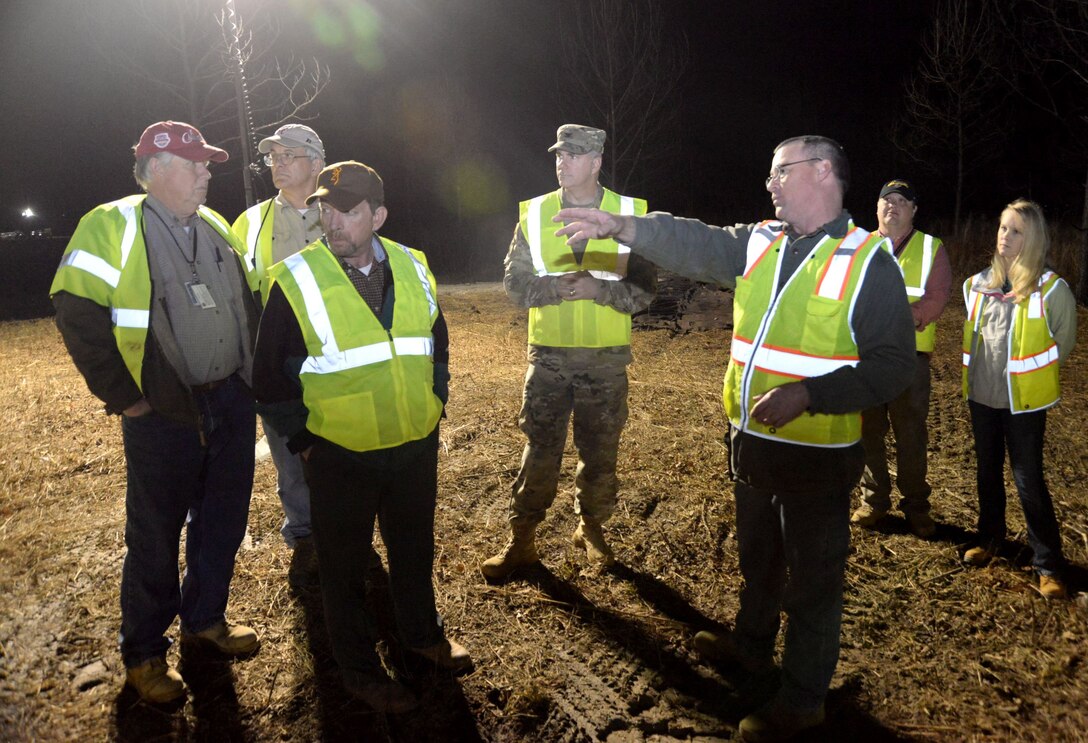 John Lewis, third from right, describes a training site layout to Col. John Hurley, commander of the U.S. Army Engineering and Support Center, Huntsville, and Huntsville Center Program Director Albert “Chip” Marin, during the leaders’ Jan. 11 visit to Redstone Arsenal. Accompanying them, from left to right, are Bill Sargent, director of Huntsville Center’s Ordnance and Explosives Directorate; Roger Young, project manager with APTIM; Jason Watson, Redstone environmental site manager; and Ashley Roeske, project manager with Huntsville Center’s Chemical/Biological Warfare Materiel Division.