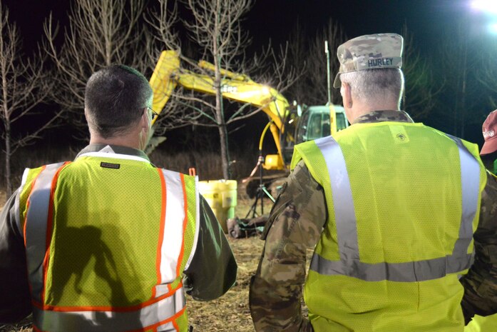 John Lewis, left, describes a training site layout to Col. John Hurley, commander of the U.S. Army Engineering and Support Center, Huntsville, during Hurley’s Jan. 11 visit to Redstone Arsenal. The training site is set up to simulate upcoming operations during which teams are slated to investigate and remove suspected World War II-era chemical warfare materiel.