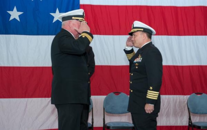 PANAMA CITY, Florida - Naval Surface Warfare Center Panama City Division (NSWC PCD) Former Executive Officer Cmdr. Paul G. Werring, USN (Ret.), left, is given permission to return ashore by NSWC PCD Commanding Officer Capt. Aaron S. Peters, USN, right, during a retirement ceremony Jan. 12, 2018. U.S. Navy photo by John Green