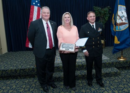 PANAMA CITY, Florida - Faith Aclin, center, receives a 2017 Outstanding Organization Support Award at Naval Surface Warfare Center Panama City Division's (NSWC PCD) 2017 Annual Awards ceremony Jan. 12, 2018. U.S. Navy photo by Eddie Green