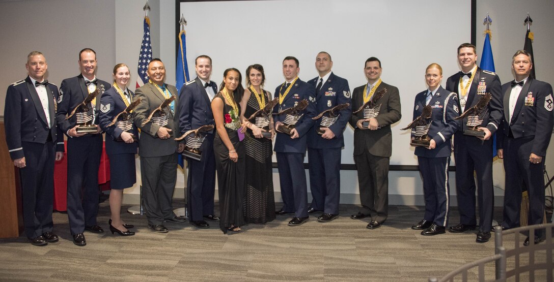 419th Fighter Wing award winners stand alongside wing leadership