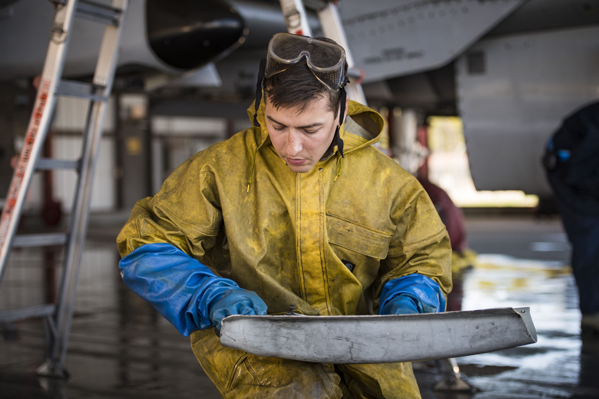 Senior Airman Michael Atkinson, 74th Aircraft Maintenance Unit dedicated crew chief, cleans a component of an A-10C Thunderbolt II, Feb. 8, 2018, at Moody Air Force Base, Ga. In addition to mechanical and electrical maintenance, A-10’s must be washed every 180 days or approximately 1,000 flying hours in order to control corrosion caused by residue from the gun and engine exhaust. (U.S. Air Force photo by Senior Airman Janiqua P. Robinson)