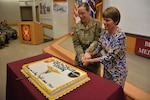 Retired Maj. Gen. Jimmie O. Keenan, former deputy commanding general (operations), U.S. Army Medical Command and Chief, U.S. Army Nurse Corps, and 2nd Lt. Jorden Fitts help celebrate the U.S. Army Nurse Corps' 117th Birthday at a Brooke Army Medical Center ceremony Feb. 2.