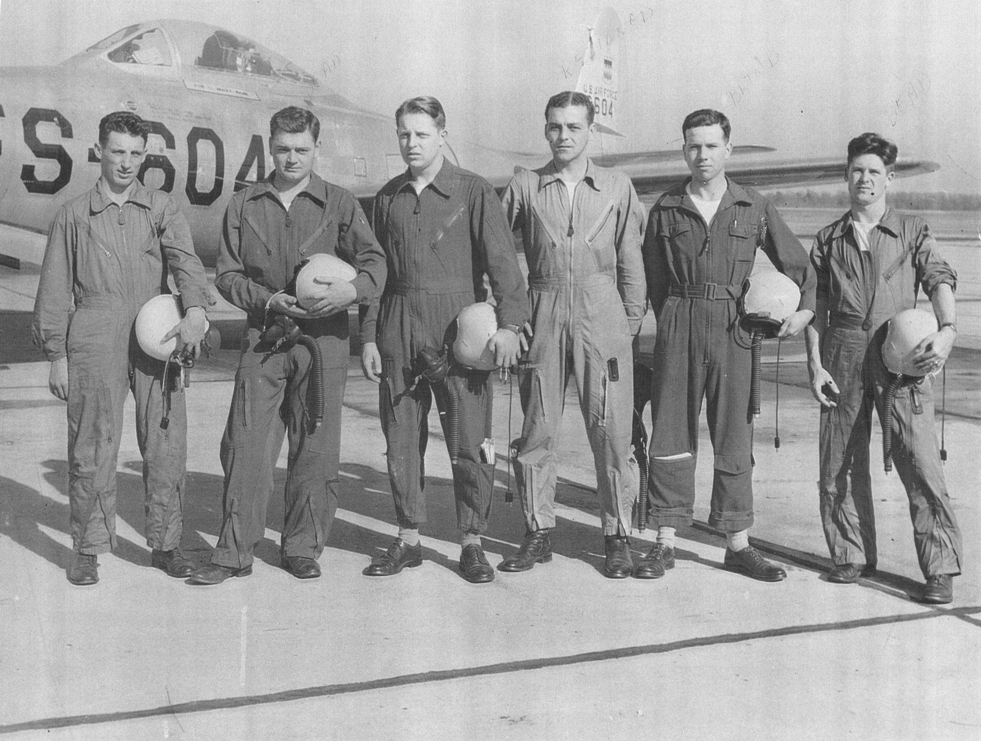 U.S. Air Force pilots assigned to the 79th Fighter Squadron (FS) stand for a photo in front of an F-84B Thunderjet at Shaw Air Force Base, S.C., circa May 1949.