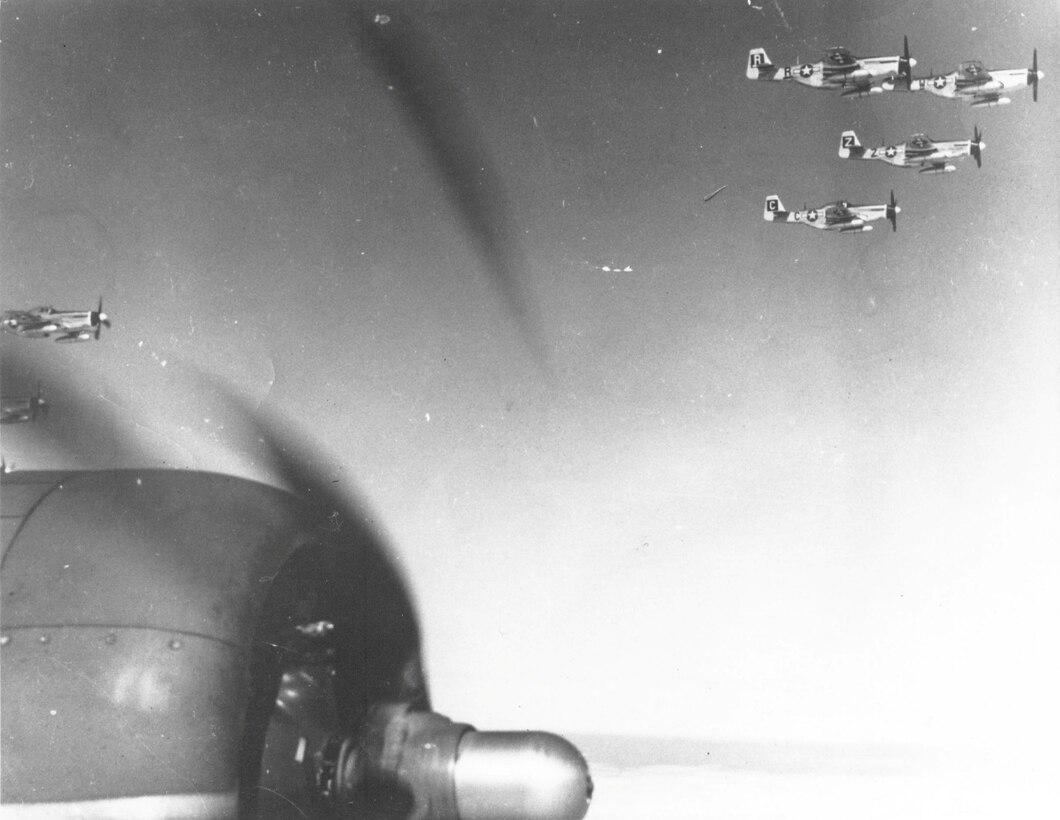 U.S. Army Air Corps pilots assigned to the 79th Fighter Squadron fly P-51 Mustangs, Sept. 11, 1944.