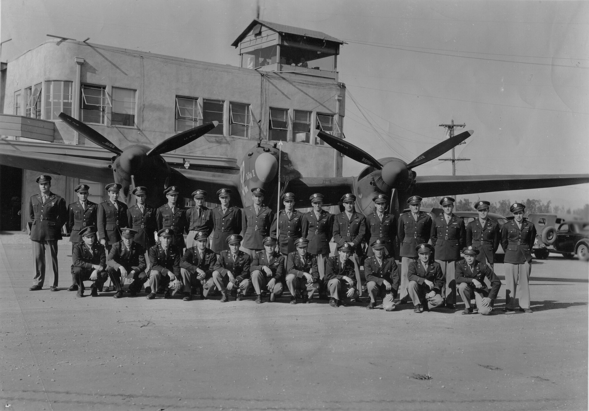 U.S. Army Air Corps pilots assigned to the 79th Fighter Squadron pose in front of a P-38 Lightning at Ontario, Calif., in 1943.