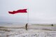 Staff Sgt. Nathan Rust, 90th Security Support Squadron combat arms instructor, raises the range flag