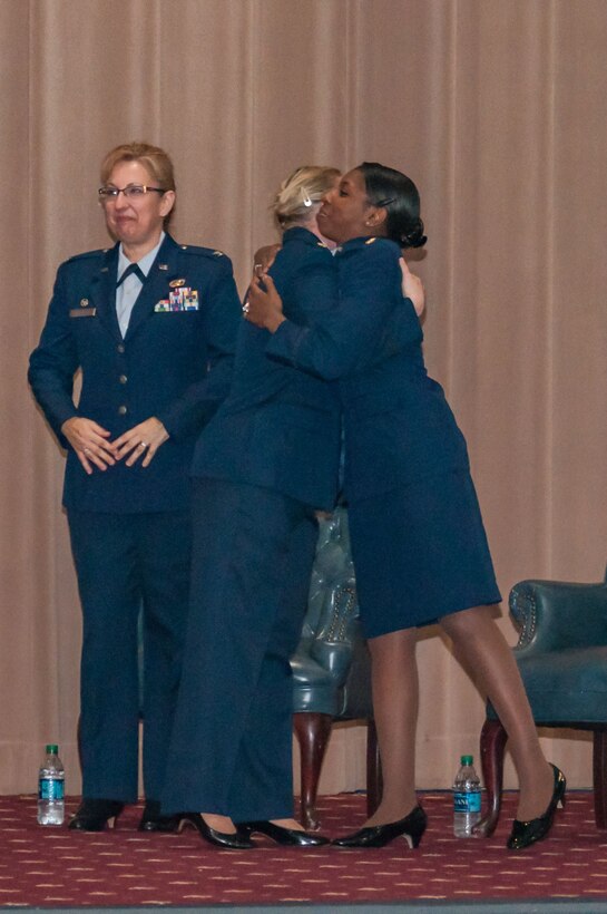 U.S Air Force Maj. Jessica Sellers, 307th Force Support Squadron Commander, hugs Maj. Beth Hart, previous 307th Force Support Squadron Commander, during a change of command ceremony at Barksdale Air Force Base, Louisiana, Feb. 10, 2018.