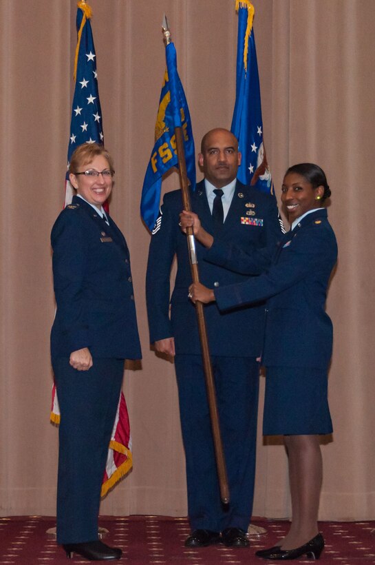 U.S Air Force Col. Sandra Vandiviere, 307th Mission Support Group commander, hands the 307th Force Support Squadron guidon to Maj. Jessica Sellers, 307th FSS, during a change of command ceremony at Barksdale Air Force Base, Louisiana, Feb. 10, 2018.