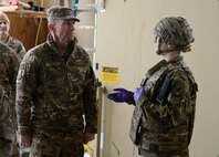Gen. Mike Holmes, commander of Air Combat Command, receives a medical brief from Senior Airman Jessica Eyler, 455th Expeditionary Medical Group medic, Feb. 9, 2018 at Bagram Airfield, Afghanistan.