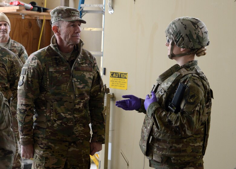 Gen. Mike Holmes, commander of Air Combat Command, receives a medical brief from Senior Airman Jessica Eyler, 455th Expeditionary Medical Group medic, Feb. 9, 2018 at Bagram Airfield, Afghanistan.