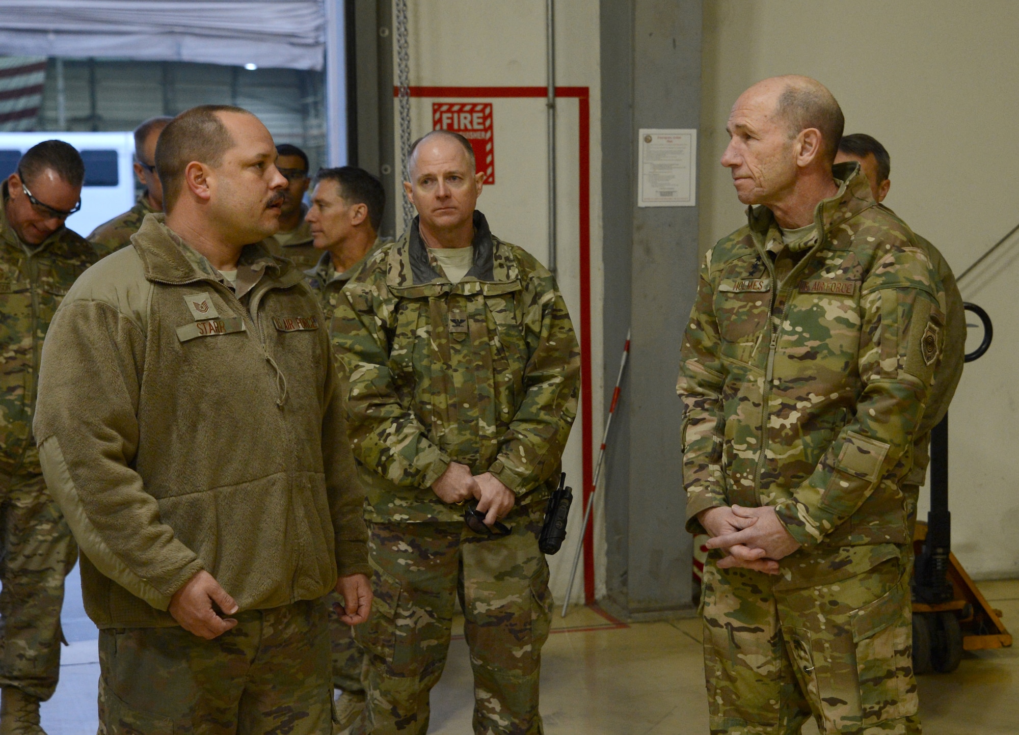 Gen. Mike Holmes, commander of Air Combat Command, speaks with Tech. Sgt. Christopher Starr, from the 455th Expeditionary Maintenance Squadron, during his visit Feb. 9, 2018 at Bagram Airfield, Afghanistan.