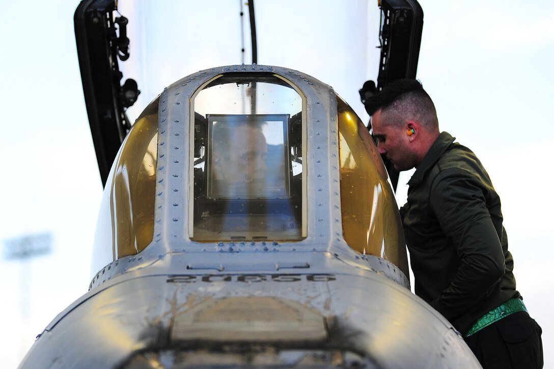 Airmen perform preflight maintenance checks on an A-10C Thunderbolt II.