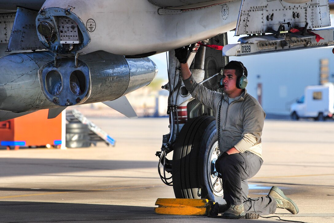 Air Force Senior Airman Daniel Alcaraz performs preflight maintenance checks on an A-10C Thunderbolt II.