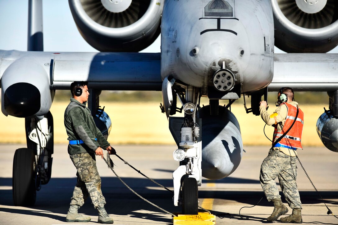 Airmen perform final checks on an A-10C Thunderbolt II.