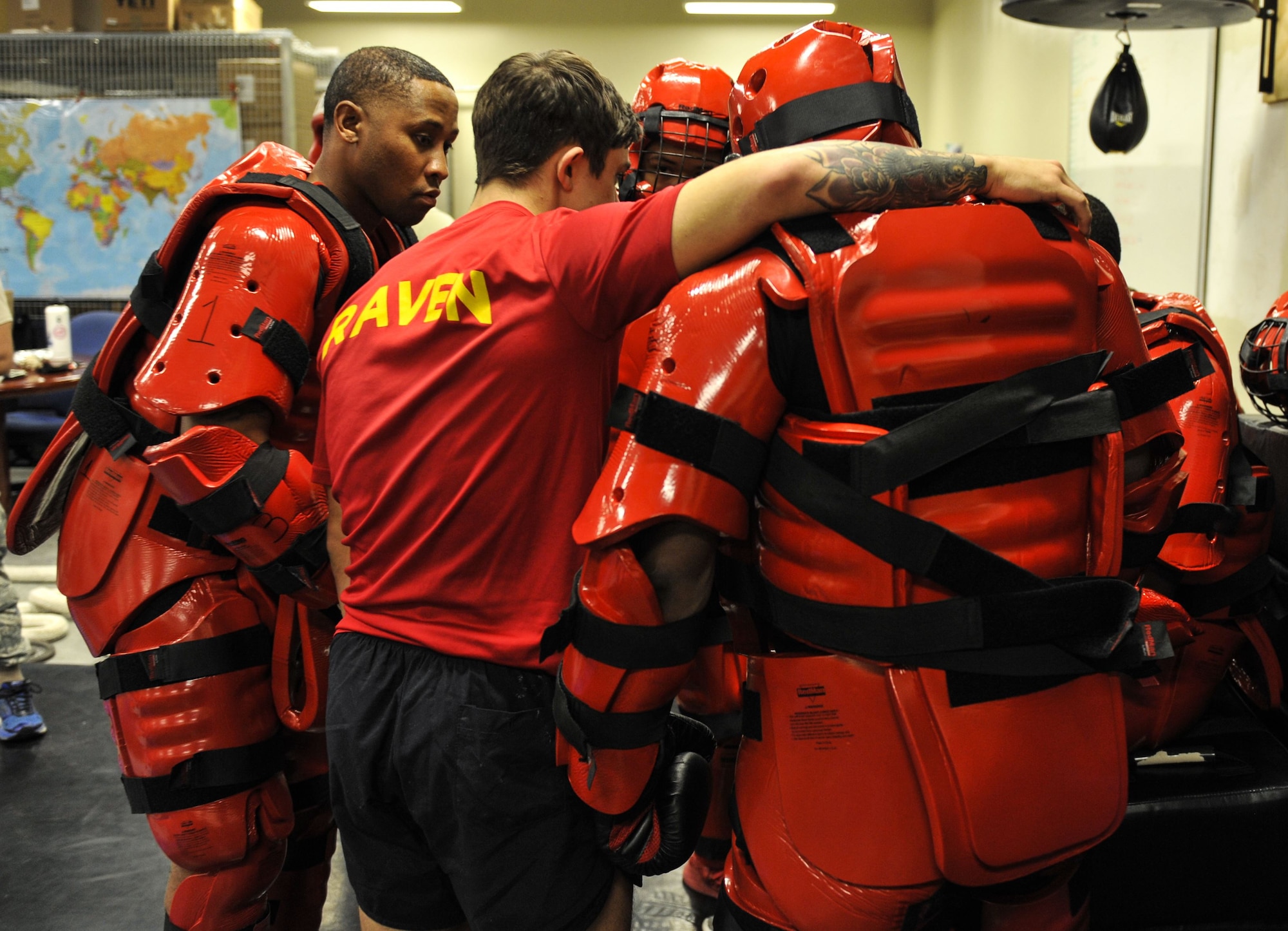 Phoenix Ravens with the 628th Security Forces Squadron engage in a group huddle before beginning RedMan training Jan. 31, 2018, at Joint Base Charleston, S.C.