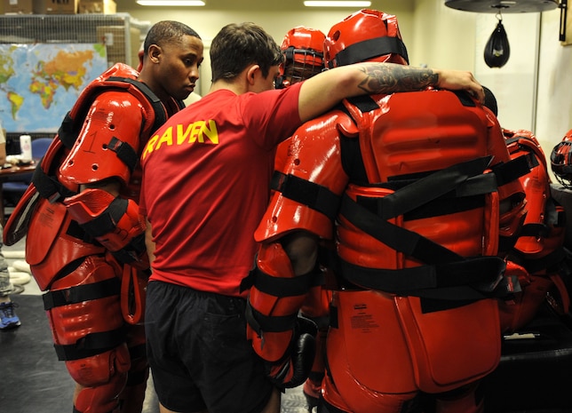 Phoenix Ravens with the 628th Security Forces Squadron engage in a group huddle before beginning RedMan training Jan. 31, 2018, at Joint Base Charleston, S.C.