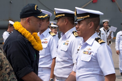 180211-N-XK809-260 LAEM CHABANG, Thailand (Feb. 11, 2018) Capt. Richard LeBron, executive officer of the amphibious assault ship USS Bonhomme Richard (LHD 6), greets Royal Thai Navy officers upon the ship’s arrival to Laem Chabang.