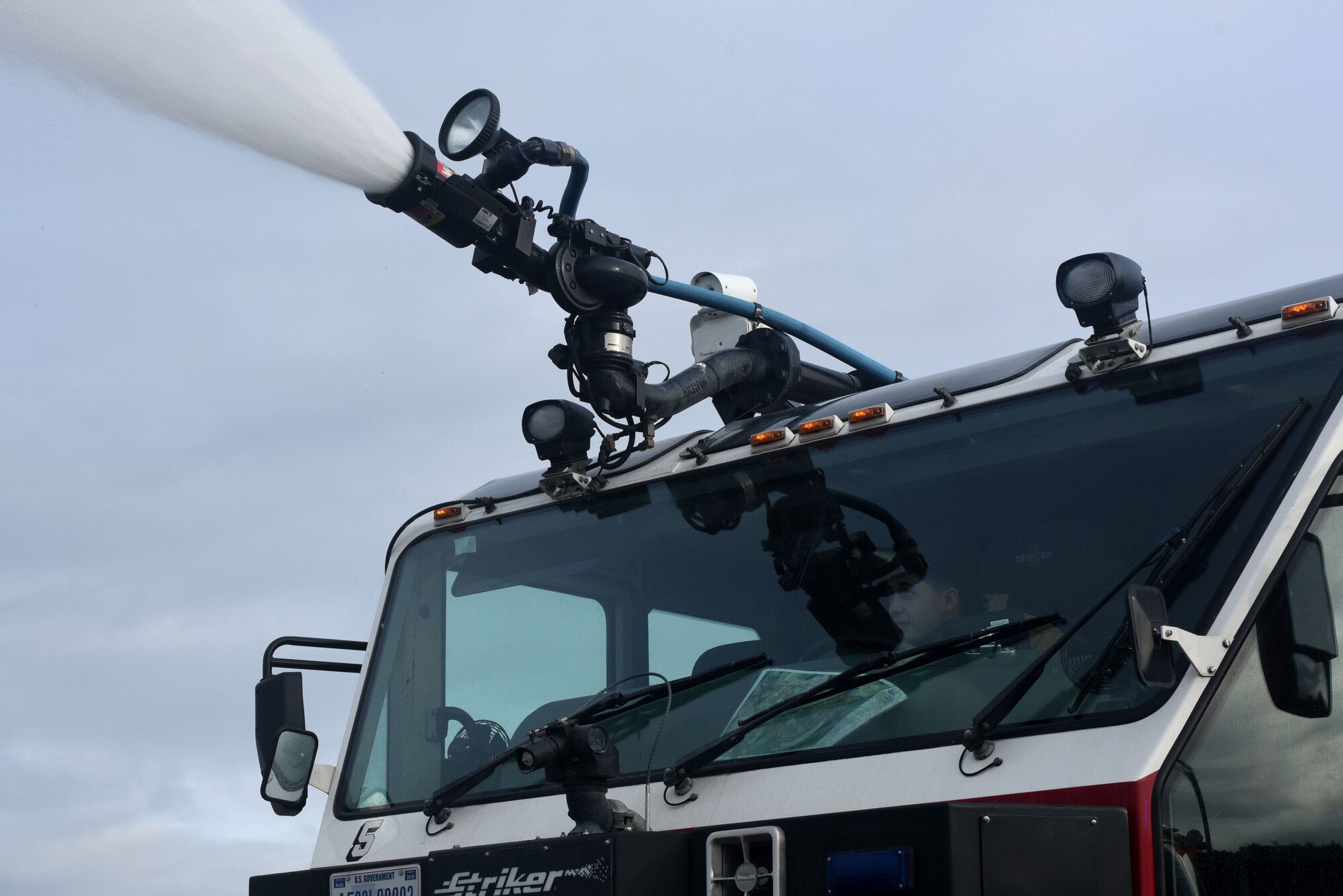 An Airman assigned to the 48th Civil Engineer Squadron operates a firetruck at Royal Air Force Lakenheath, England, Feb. 8. RAF Lakenheath firefighters are trained to respond to a wide variety of emergencies. (U.S. Air Force photo/Airman 1st Class Eli Chevalier)