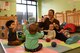 Cheryl Champagne, 20th Force Support Squadron Child Development Center (CDC) program assistant, blows bubbles for children at the CDC at Shaw Air Force Base, S.C., Feb. 12, 2018.