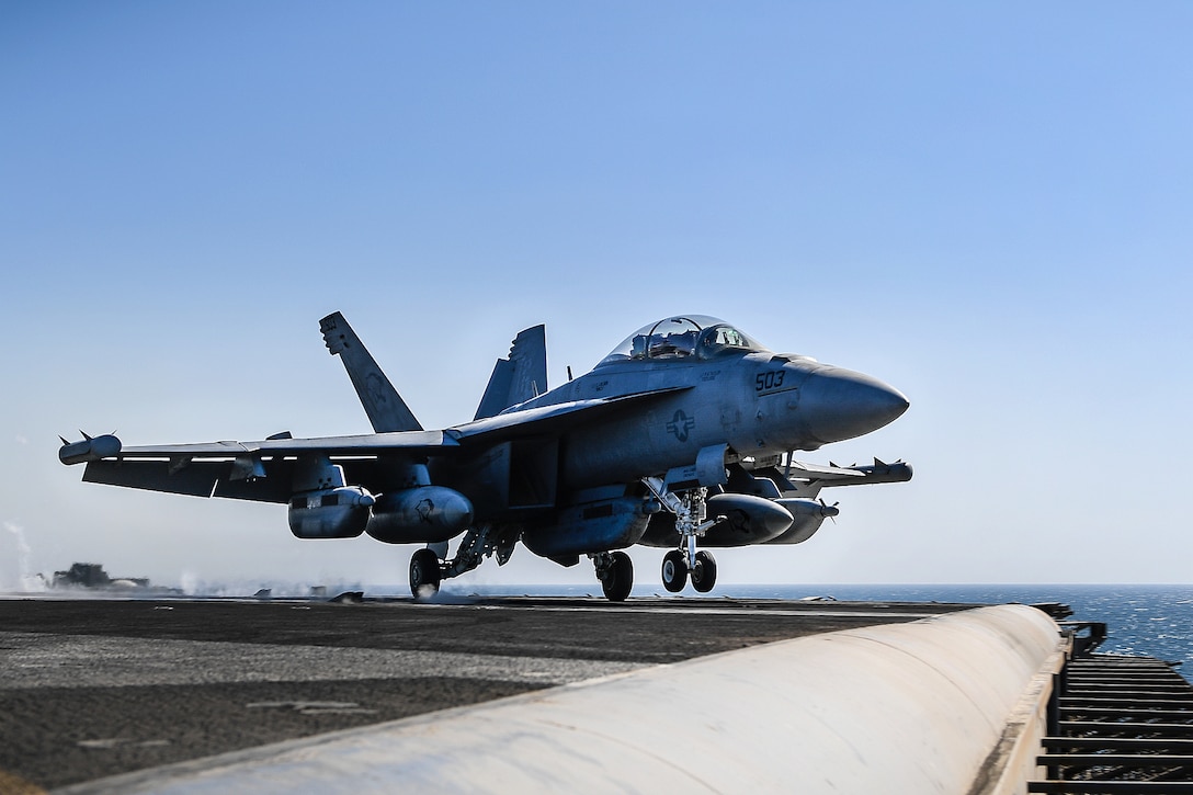 An EA-18G Growler aircraft launches from the flight deck of the aircraft carrier USS Theodore Roosevelt.