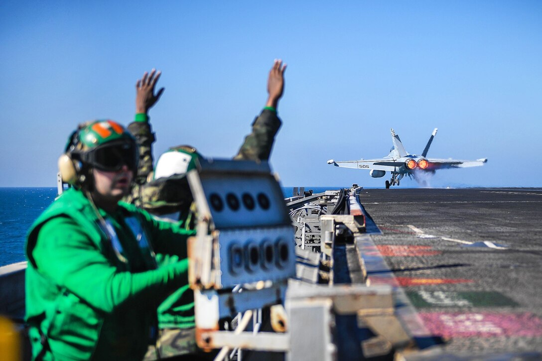 An EA-18G Growler launches from the flight deck of the aircraft carrier USS Theodore Roosevelt.