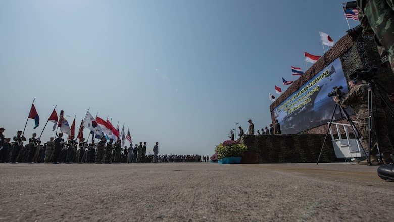 U.S. Ambassador to Thailand Glyn Davies, Gen. Thanchaiyan Srisuwan, Chief of Defense Forces in Thailand, and U.S. Marine Corps. Lt. Gen. Lawrence Nicholson, III Marine Expeditionary Force commanding general, address forces from all seven participating nations in Exercise Cobra Gold 2018 during the opening ceremony Feb. 13, 2018, at U-Tapao International Airport, Ban Chang district, Rayong province, Thailand. Cobra Gold 18 provides a venue for both United States and partner nations to advance interoperability and increase partner capacity in planning and executing complex and realistic multinational force and combined task force operations. The annual exercise is conducted in the Kingdom of Thailand held from Feb. 13-23 with seven full participating nations.