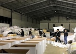 Personnel from a contracted DLA Troop Support Clothing and Textiles vendor in Erbil, Iraq package winter clothing kits for nearly 15,000 internally displaced persons returning to a liberated Raqqah, Syria December 19, 2017. C&T supported the U.S. Agency for International Development’s humanitarian support request for 2,500 winter clothing kits, including boots, socks, coats and blankets by mid-January.