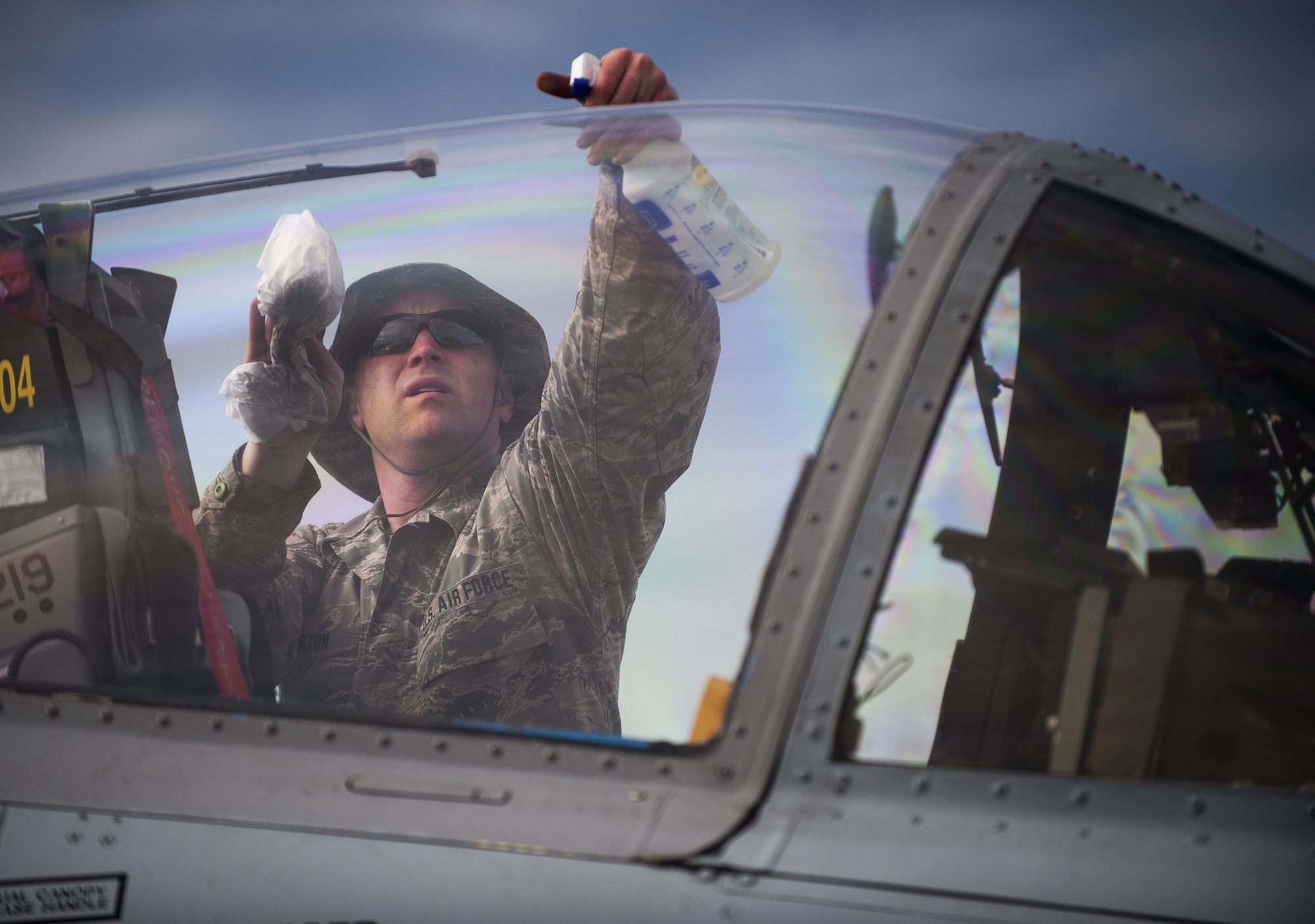 Staff Sgt. Aaron Barton, a crew chief with the 122nd Fighter Wing, cleans conducts a preflight inspection on an A-10C Thunderbolt II “Warthog” aircraft during Operation Guardian Blitz, Jan 25, 2018, at MacDill Air Force Base, Fla. Guardian Blitz is a two-week joint exercise to improve service interoperability for combat search and rescue and close air support. (U.S. Air National Guard photo by Staff Sgt. William Hopper/Released)