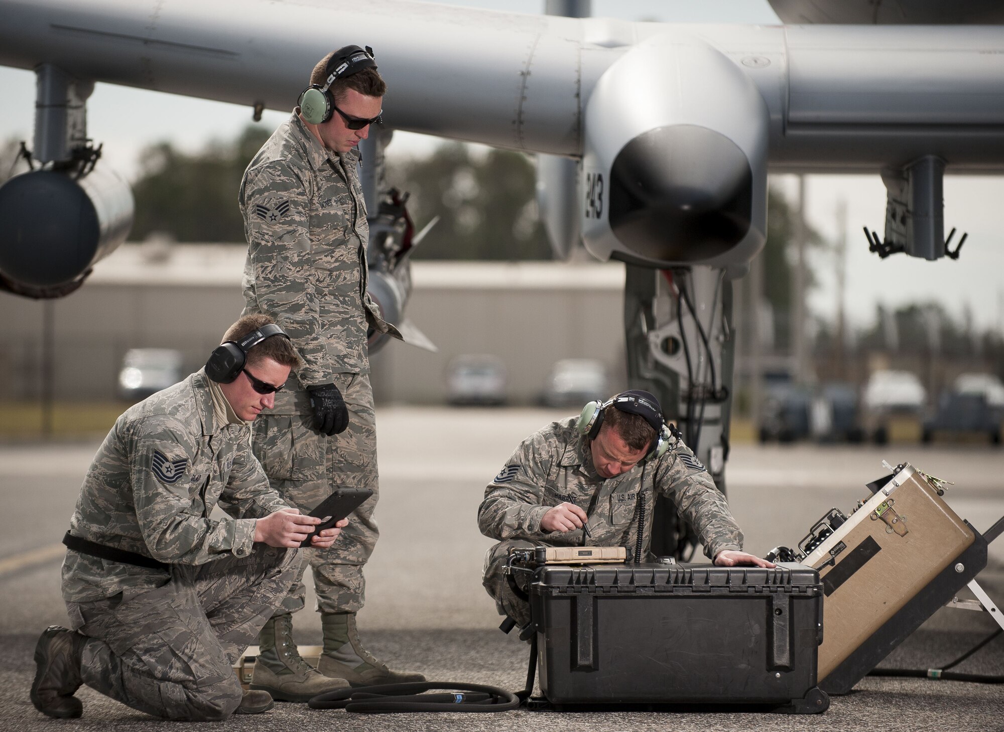 Tech. Sgt. Jack Glad, 122nd Weapons Load, left, Senior Airman Logan Jones, 122nd Avionics, and Tech. Sgt. Mathew Habart, 122nd Avionics, from the 122nd Fighter Wing, Fort Wayne, Ind.,  upload avionics software to an A-10C Thunderbolt II “Warthog” during Operation Guardian Blitz, Jan 25, 2018, at MacDill Air Force Base, Fla. Guardian Blitz is a two-week joint exercise to improve service interoperability for combat search and rescue and close air support. (U.S. Air National Guard photo by Staff Sgt. William Hopper/Released)