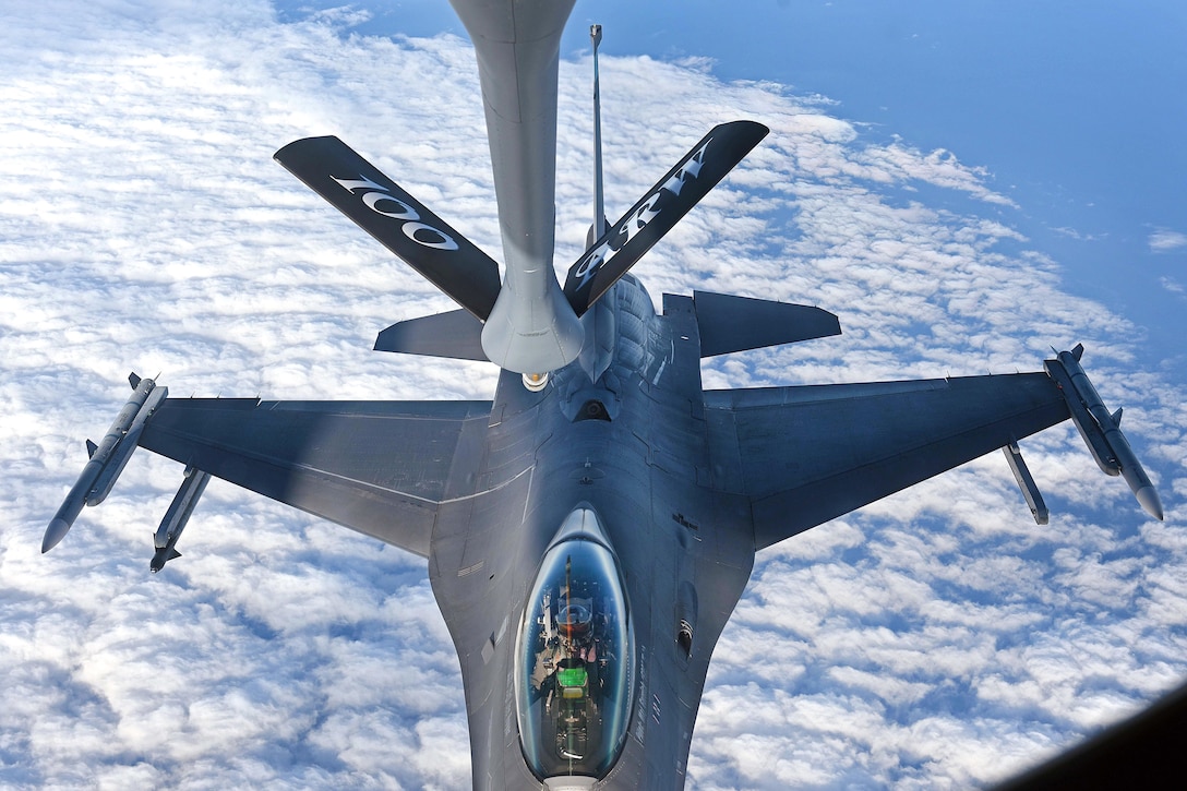 An Air Force F-16C Fighting Falcon prepares to receive fuel from a KC-135 Stratotanker.