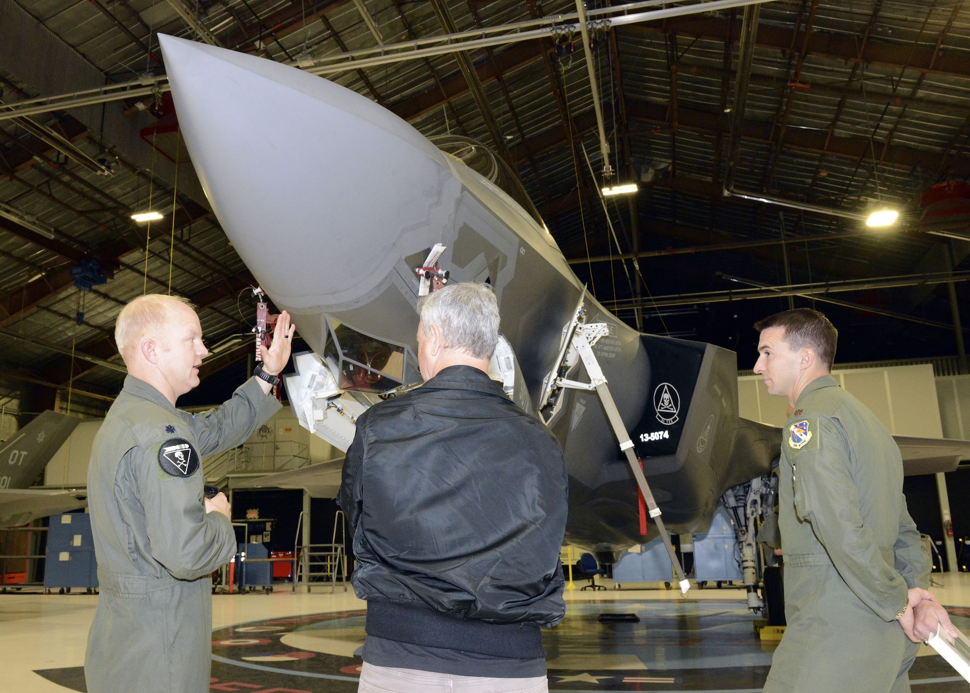 Film and TV actor Gary Sinise was given a tour of the 31st Test and Evaluation Squadron Feb. 11 before performing a free concert for the Edwards community Feb. 11. Sinise received a planeside briefing from three test pilots who talked about the F-35 Lightning II, which is a fifth-generation fighter aircraft being tested at Edwards. (U.S. Air Force photo by Kenji Thuloweit)