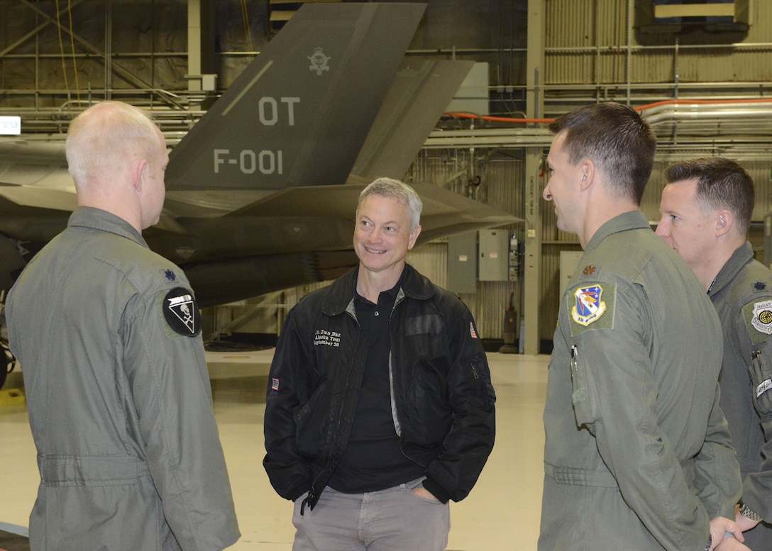 Film and TV actor Gary Sinise was given a tour of the 31st Test and Evaluation Squadron Feb. 11 before performing a free concert for the Edwards community Feb. 11. Sinise received a planeside briefing from three test pilots who talked about the F-35 Lightning II, which is a fifth-generation fighter aircraft being tested at Edwards. (U.S. Air Force photo by Kenji Thuloweit)