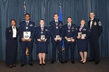 Airmen of Airman Leadership School Class 18 Bravo, who earned top honors, pose for a photo with Col. Yvonne Spencer, 92nd Mission Support Group commander, and Chief Master Sgt. Lee Mills, 92nd Air Refueling Wing command chief, Feb. 8, 2018, at Fairchild Air Force Base, Washington. ALS is a five-week course that focuses on leadership abilities, profession of arms and effective communication in the workplace. (U.S. Air Force photo/Airman 1st Class Whitney Laine)