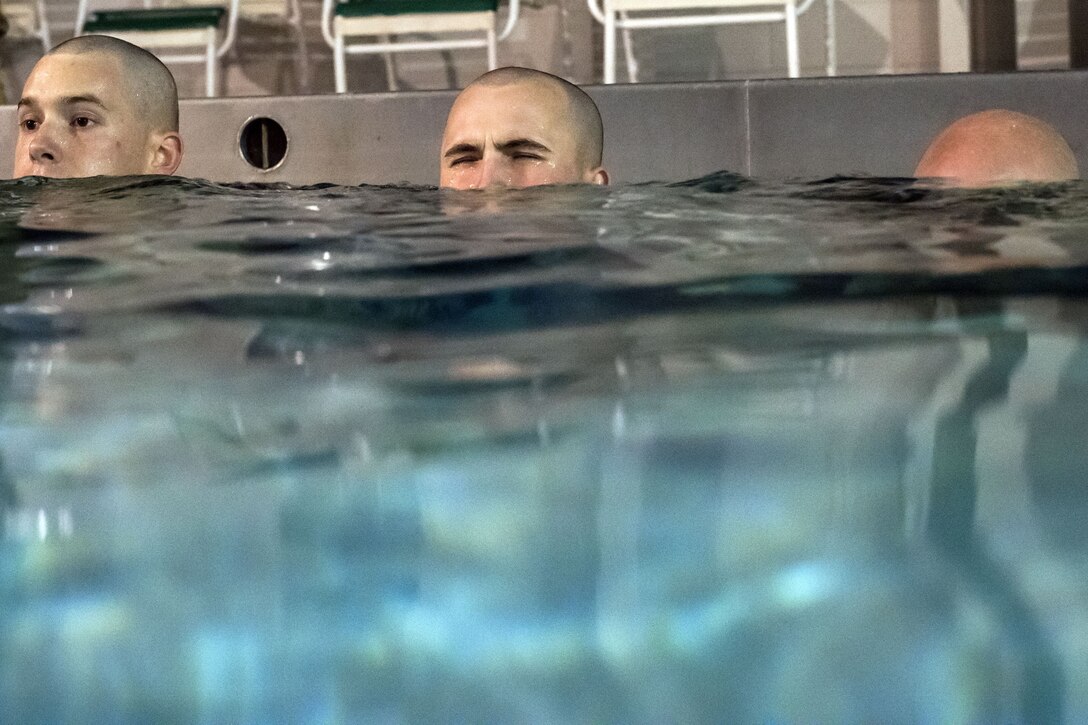 Airmen submerge their heads, during a water survival assessment, Feb. 9, 2018, at Moody Air Force Base, Ga. The assessment is part of a three-day ranger assessment that’s designed to determine whether Airmen are ready to attend the Air Force pre Ranger-Assessment Course held at Fort Bliss Army post, Texas. The Ranger cadre test Airmen’s physical fitness, tactical abilities, land navigation skills, leadership qualities, water confidence and academic ability to determine if they have the knowledge and will to become Ranger qualified. (U.S. Air Force photo by Airman Eugene Oliver)