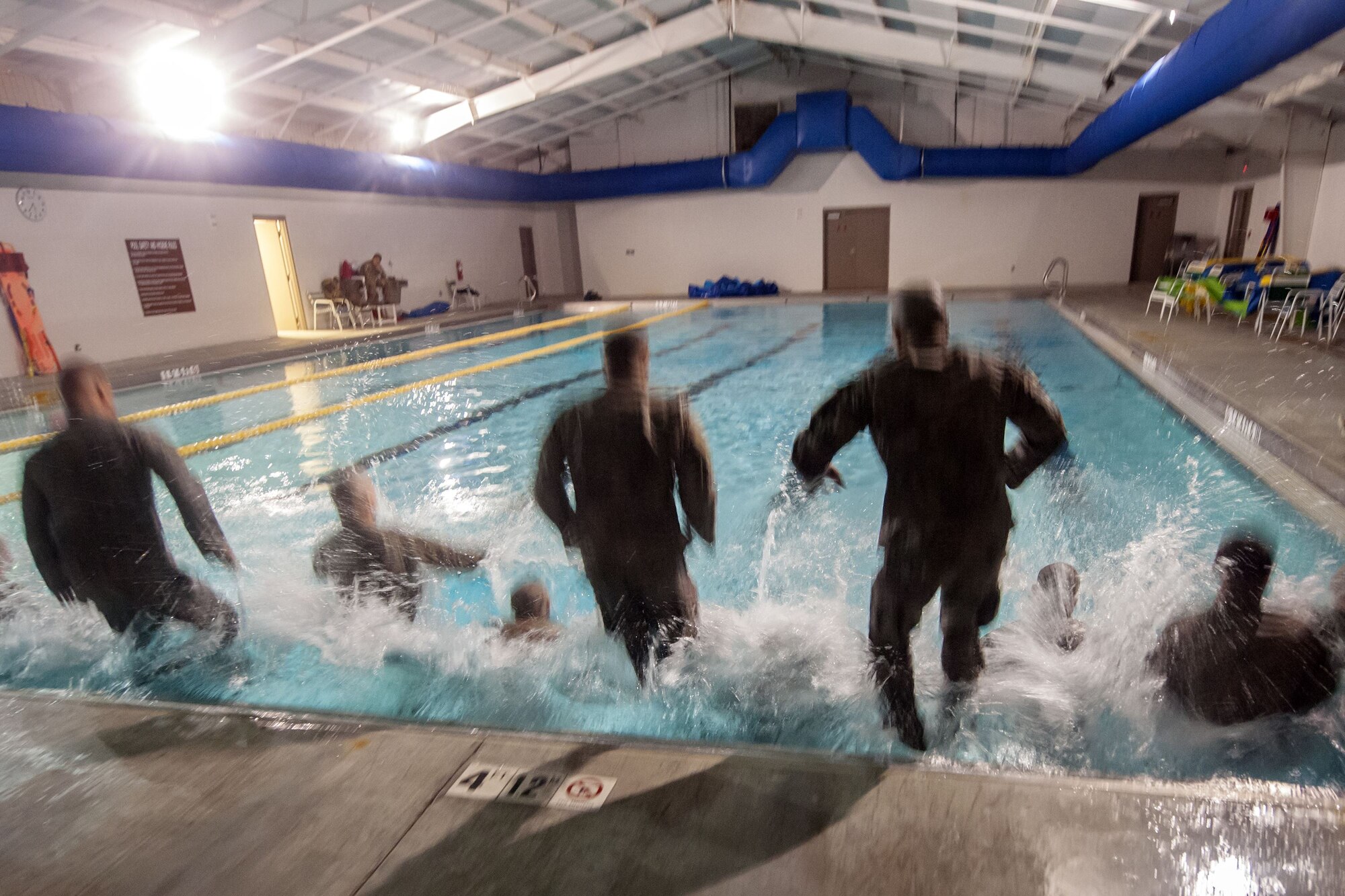 Airmen jump into a pool during a water survival assessment, Feb. 9, 2018, at Moody Air Force Base, Ga. The assessment is part of a three-day ranger assessment that’s designed to determine whether Airmen are ready to attend the Air Force pre Ranger-Assessment Course held at Fort Bliss Army post, Texas. The Ranger cadre test Airmen’s physical fitness, tactical abilities, land navigation skills, leadership qualities, water confidence and academic ability to determine if they have the knowledge and will to become Ranger qualified. (U.S. Air Force photo by Airman Eugene Oliver)